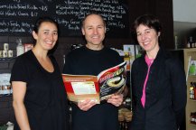 One of the Armidale eateries taking pride in selling local produce is Bottega Caffé and Delicatezza; owners/operators Phillip and Donella Tutt are pictured here with Regional Development Australia Northern Inland Project Officer, Kim-Trieste Hastings.