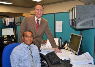 Uralla Shire Council General Manager Andrew Hopkins at work with Corporate Accountant Mustaq Ahammed, who migrated from Bangladesh