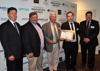 Optus Armidale Manager Lachlan Brown (second from right) presented a category winning trophy to the Mailler’s Chillamurra Solar Farm, Boggabilla. Pictured are Rob, David, Michael and Peter Mailler.
