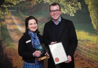 Mary Hollingworth receives her NSW Government Community Service Award from Northern Tablelands MP Adam Marshall in Glen Innes earlier this month.
