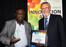 The Australian Cotton Research Institute's Dr Robert Mensah was presented with a “Research and Education” finalist trophy by Northern Tablelands Local Land Services' Grahame Marriott.