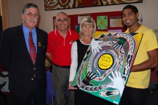 Deputy Chair of RDANI, Herman Beyersdorf; The New England North West region’s Aboriginal Customer Service Officer for Fair Trading, Brett Cunningham; Armidale Fair Trading Centre Manager, Sally-Anne Burrow; and Open Indigenous Award winner, Nicholas Levy with his artwork.